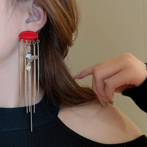 Elegant red crescent long tassel earrings with butterfly and crystal drop detail