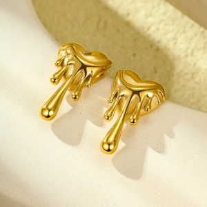 Vintage 18K gold stainless steel heart melting stud earrings on a minimalist stand