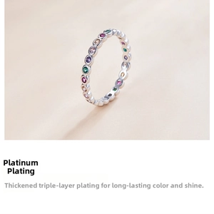 Detail showing white gold plated stackable ring with colorful rainbow pave zircons