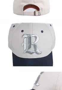 Detail view of two-tone baseball cap with 3D letter R embroidery and metal buckle