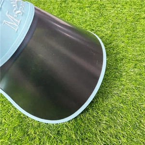 Detail of light blue sun visor with embroidered M. Sport logo and transparent black brim