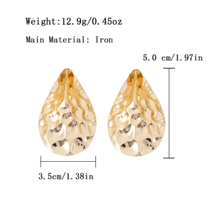 Golden teardrop metal earrings with hammered texture and precise size measurements