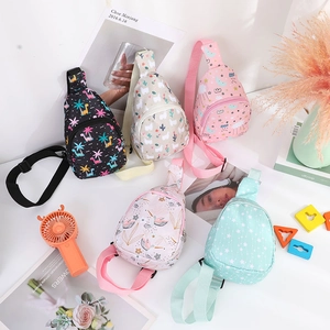Flat lay of nylon kids chest bags in dinosaur, alpaca, and cloud patterns for toddlers