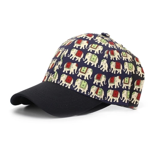 Detailed view of navy blue elephant print baseball cap with black twill brim and stitching
