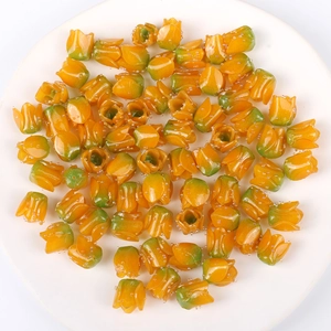 Close-up of orange gradient acrylic tulip flower beads for DIY jewelry and hair accessories