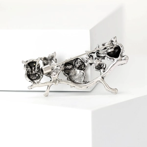 Detail view of the silver-tone alloy brooch back featuring a sturdy metal pin fastener