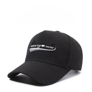 Detail of silver letter embroidery on black cotton twill six-panel baseball cap