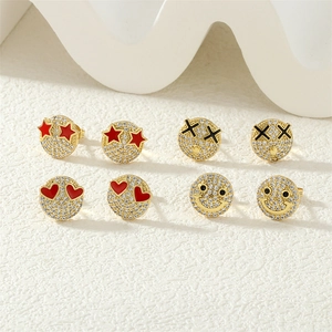 Macro shot of 18K gold plated earring set with micro-paved zircons and enamel charms