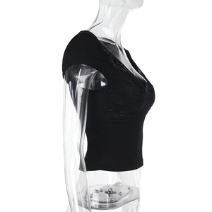 Detail view of black slim fit crop top with lace stitching on the chest and side profile