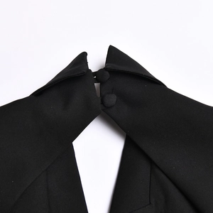 Detail view of the black dress collar featuring lapel design and two matching buttons