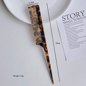 Detail view of cellulose acetate fine tooth comb with tortoise pattern and 24cm length