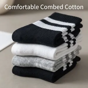 Classic striped combed cotton mid-calf sports socks in black and white tones