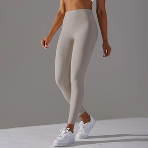 Detail of high waisted nude feel yoga pants in light grey showing seam quality and stretch