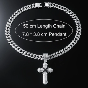Silver Cuban chain with iced-out cross pendant featuring black X and 50cm length