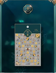 Macro shot of 5D embroidered nail stickers with yellow flowers and bees model TS-112