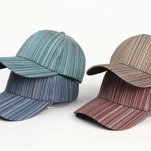 Unisex colorful vertical striped baseball caps in blue, green, and brown fabric