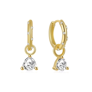 Macro shot of gold-plated S925 silver hoop earrings with a triangle zircon drop pendant