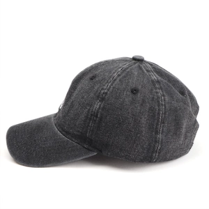 Detailed side view of washed denim baseball cap in charcoal gray with stitched eyelets