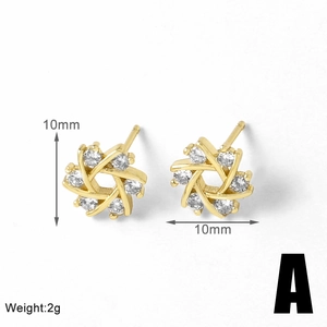 Macro detail of 10mm gold flower stud earrings with sparkling clear cubic zirconia