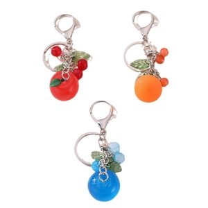 Set of three cute fruit-themed keychains featuring apple, orange, and blueberry charms