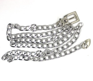 Flat lay of a silver metal hip-hop chain belt with a rectangular buckle on white background