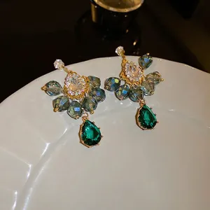 Bohemian teardrop earrings with crystals and emerald green pear-shaped pendant charms