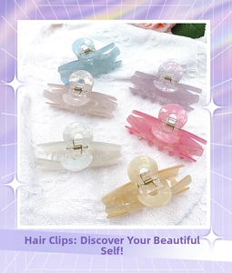 Macro detail of acrylic hair claws in six colors with marble texture and metal springs