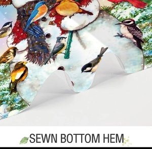 Detailed close-up showing the high-quality sewn bottom hem on a winter themed shower curtain