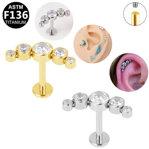Detailed view of G23 titanium labret studs with five gradient round cubic zirconia gems