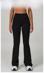 Detail shot of premium black high-waisted flared yoga pants with reinforced stitching
