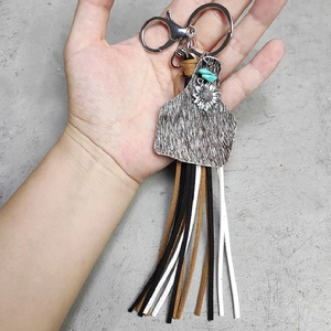 Bohemian cowhide tassel keychain with sunflower charm and western cow print patterns