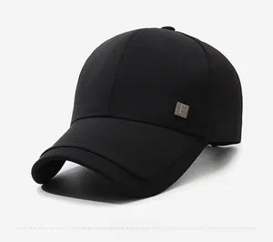Detailed side view of black hard-top baseball cap with square metallic logo F