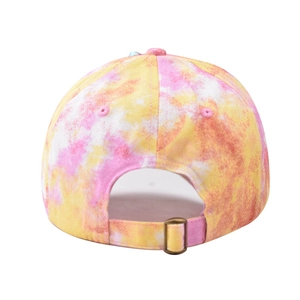 Detail of colorful tie-dye baseball cap featuring an adjustable bronze metal buckle back