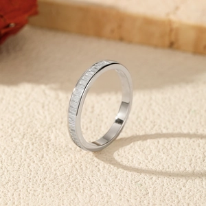 Elegant S925 sterling silver channel set baguette moissanite ring on textured surface