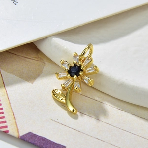 Golden sunflower necklace pendant featuring white zircon petals and black gemstone core