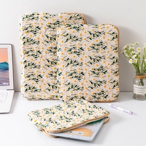 Set of three embroidered daisy quilted laptop sleeves in various sizes for iPad and notebook
