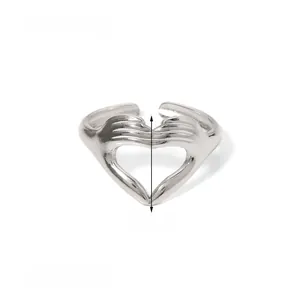 Detail of silver heart-shaped ring weighing 2g with adjustable open-band design
