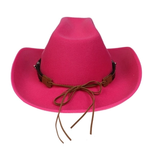 Detail of rose red wool western cowboy hat with brown leather band and metallic accents