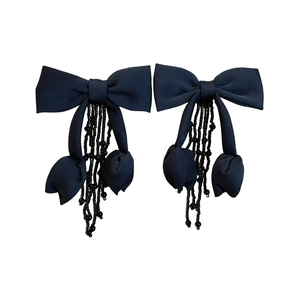 Elegant black fabric bow earrings with crystal tassel and beads on white background