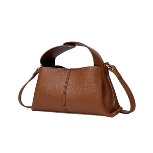 Brown litchi leather trapezoid handbag with gold hardware and detachable shoulder strap