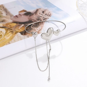 Silver molten heart cuff bracelet with elegant long chain tassels and liquid metal texture