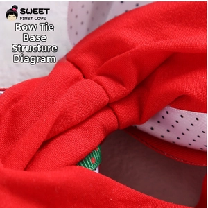 Detailed close-up showing the bottom structural stitching of a red fabric bow headband