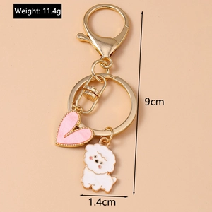 Detailed view of pink heart and white dog keychain with weight 11.4g and 9cm length specs