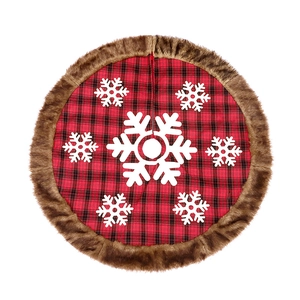 Red and black plaid Christmas tree skirt with white snowflakes and brown faux fur trim