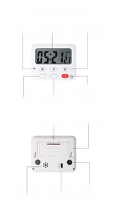 Detail of digital kitchen timer showing large LCD screen, magnetic back and foldout stand