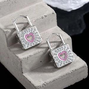 Silver lock-shaped huggie earrings with pink heart crystals and clear zircon stones