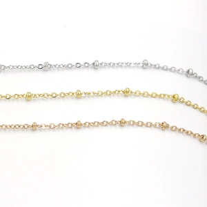 Detailed shot of stainless steel satellite bead chains in silver, gold and rose gold