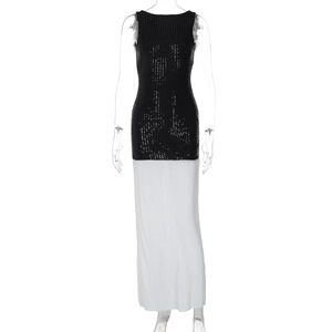 Detail of elegant black sequin bodice and white pleated skirt on a backless maxi dress