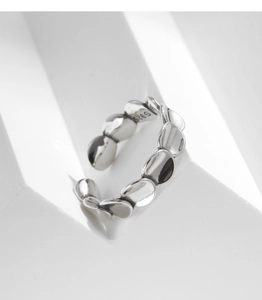 Close-up of S925 sterling silver hallmarked irregular scales on an open ring band