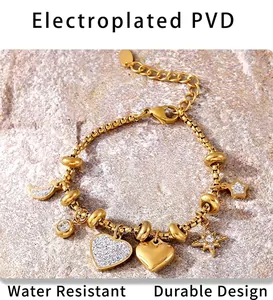 Detail of PVD gold plated heart and star charms on a luxury stainless steel bracelet